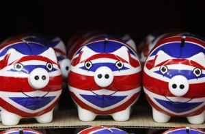 A row of piggy banks adorned with the colours of Britain's Union Jack flag are displayed in a souvenir shop in London